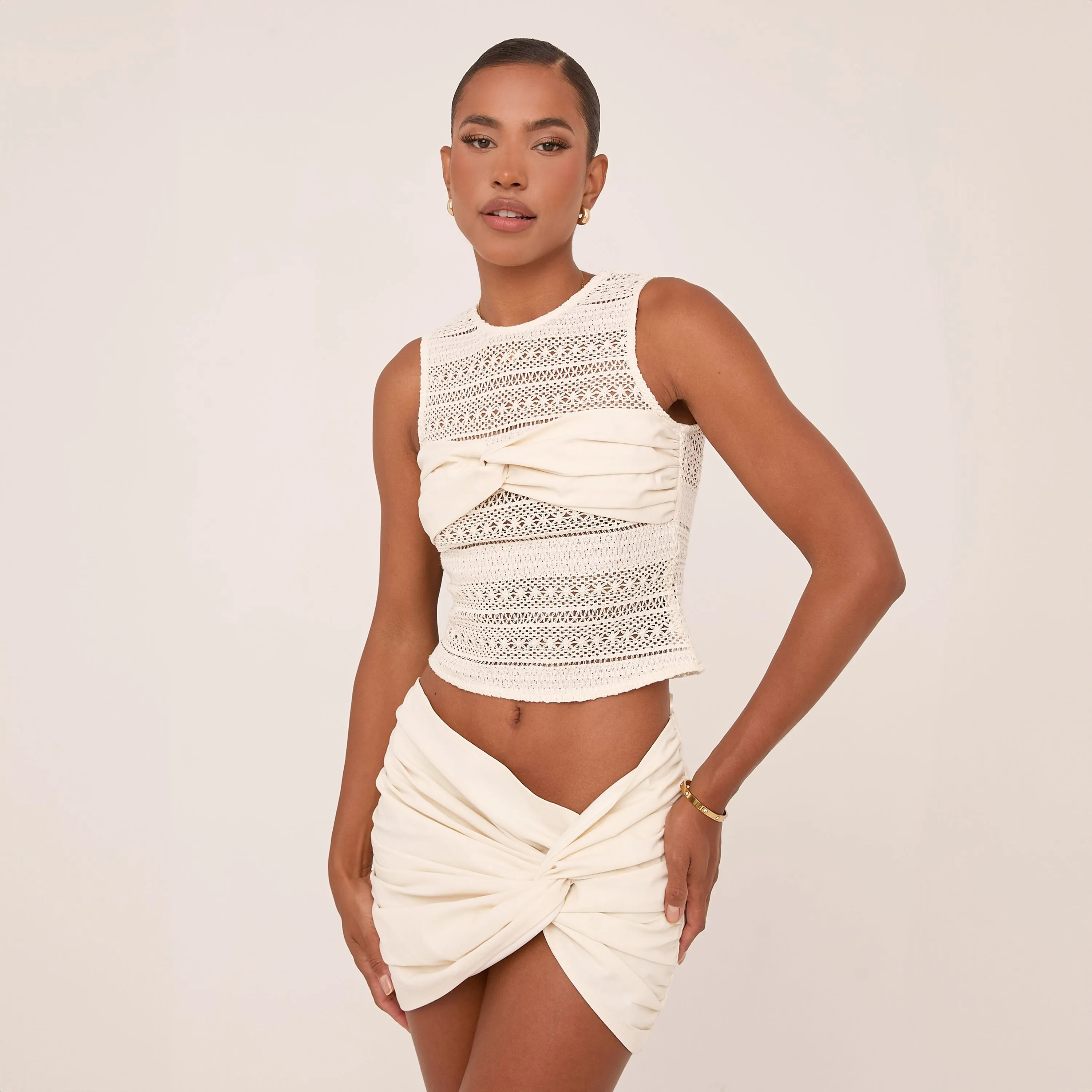 Sleeveless Twisted Bust Detail Top In Cream Texture